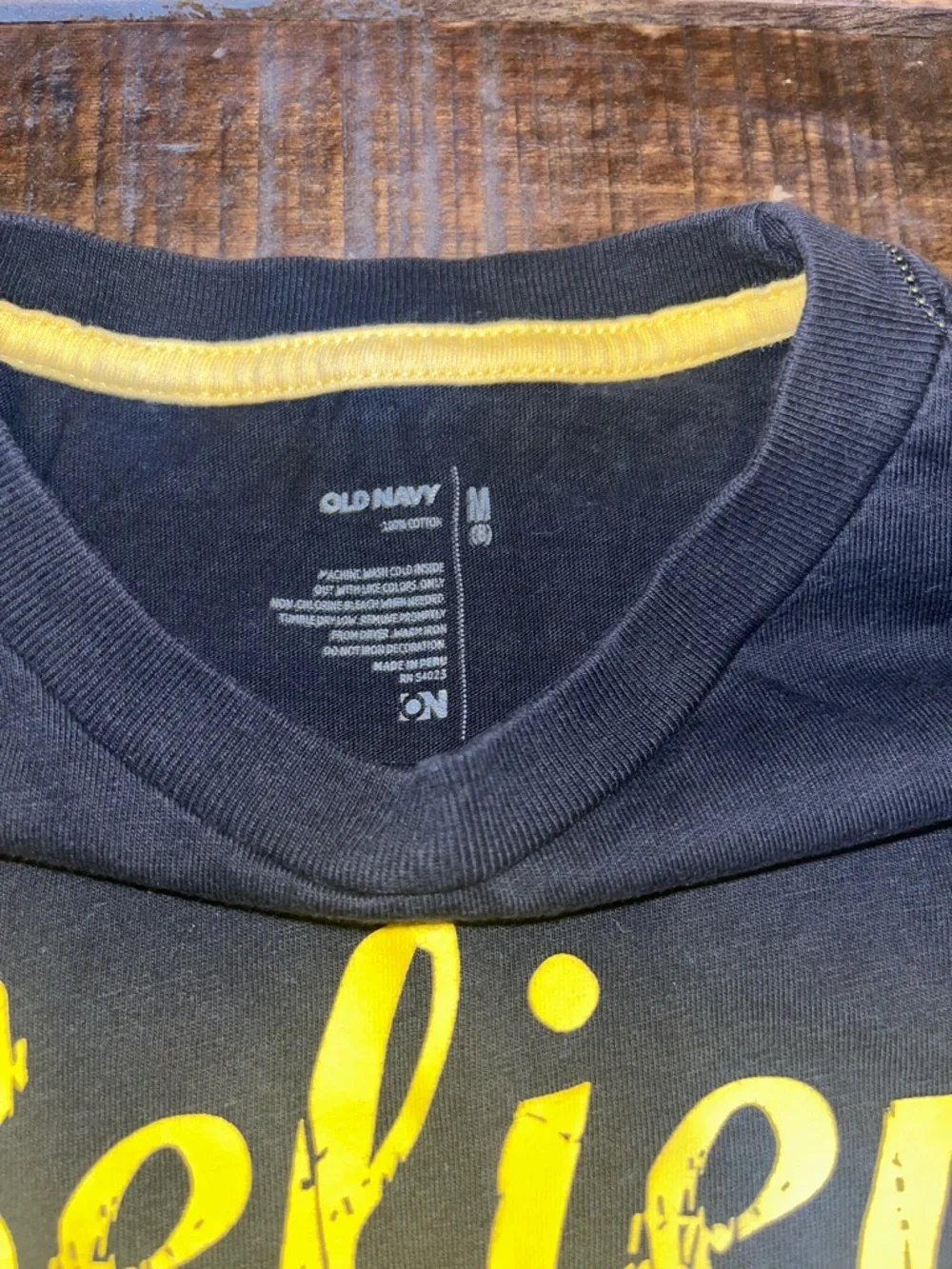Old Navy Black Tee with Yellow 'Believe The Hype' Graphic